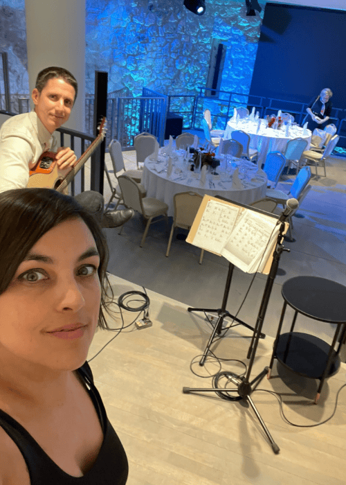 AlmAcoustic Duo providing background music for dinner at an elegant event